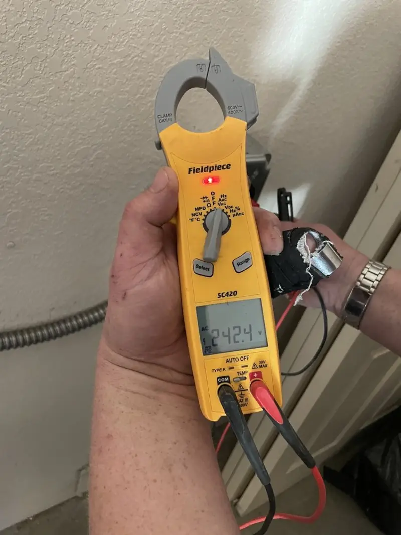 Voltage testing with clamp meter during Electrical Installation Services in Edgewater Park